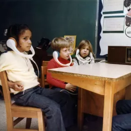 Children using instructional radio in the classroom
