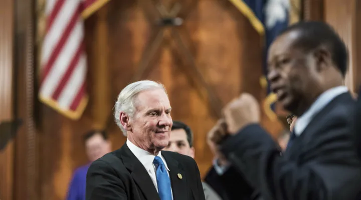 South Carolina Governor Henry McMaster greets lawmakers as Rep. Carl Anderson, D-Georgetown, right, pumps his fists after the State of the State address at the South Carolina Statehouse, Wednesday, Jan. 23, 2019, in Columbia, S.C. (AP Photo/Sean Rayford)