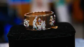 Appraisal: Art Deco Bracelet with Charms, ca. 1939: asset-mezzanine-16x9