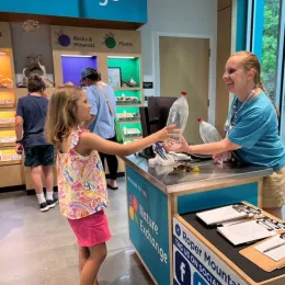 photo of students engaging at exhibits at Roper Mountain