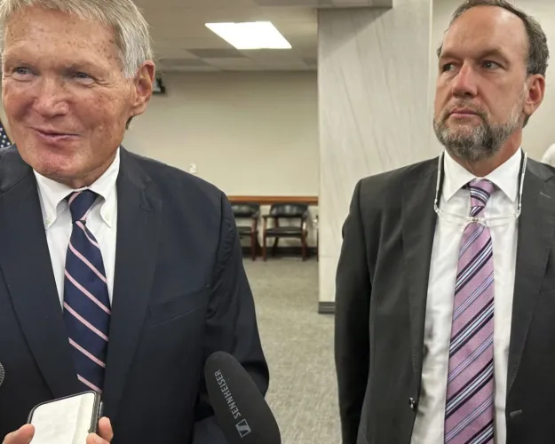 South Carolina Senate Finance Chairman Harvey Peeler, R-Gaffney, left, and House Ways and Means Chairman Bruce Bannister, R-Greenville, right, talk to reporters after a conference committee reached a budget deal, Friday, June 21, 2024, in Columbia, S.C. (AP Photo/Jeffrey Collins)