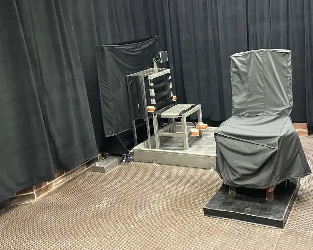 FILE - This photo provided by the South Carolina Department of Corrections shows the state's death chamber in Columbia, S.C., including the electric chair, right, and a firing squad chair, left. The South Carolina Supreme Court will hear arguments Tuesday, Feb. 6, 2024, on whether the state can use the electric chair, firing squad or a new lethal injection protocol to carry out its first executions in nearly 13 years. (South Carolina Department of Corrections via AP, File)