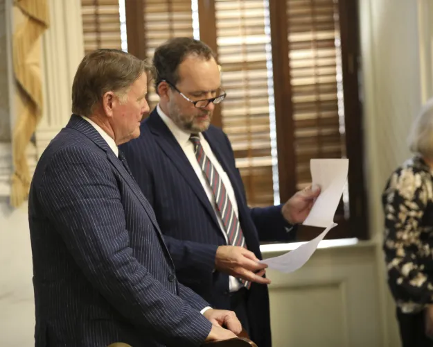 South Carolina Rep. Bill Herbkersman, R-Bluffton, left, talks to House Ways and Means Chairman Bruce Bannister, R-Greenville, right, during a budget debate on Wednesday, May 8, 2024, in Columbia, South Carolina (AP Photo/Jeffrey Collins).