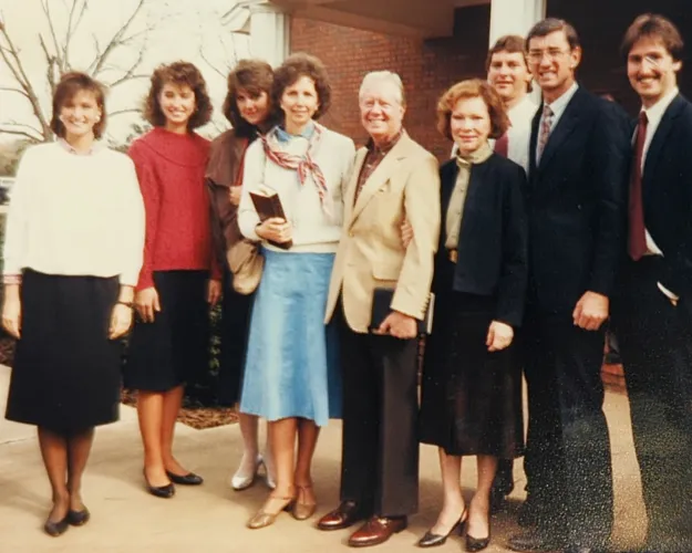 Faith Fuller, far left, and her family pose with Jimmy and Rosalynn Carter outside Maranatha Baptist Church in Plains, Ga.,, circa 1986. Fuller would attend Carter's Sunday school classes there in his post-presidency years.