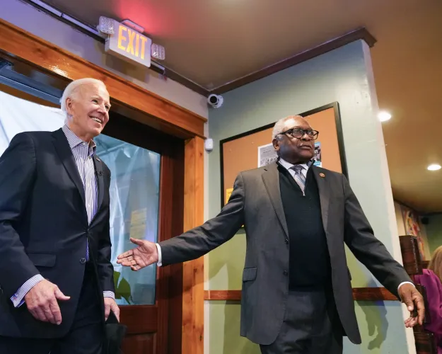 President Joe Biden, with Rep. Jim Clyburn, D-S.C., arrives at Hannibal's Kitchen in Charleston, S.C., Monday, Jan. 8, 2024 to meet and interact with diners. Earlier in the day, Biden delivered remarks at Mother Emanuel AME Church in Charleston, where nine worshippers were killed in a mass shooting by a white supremacist in 2015.