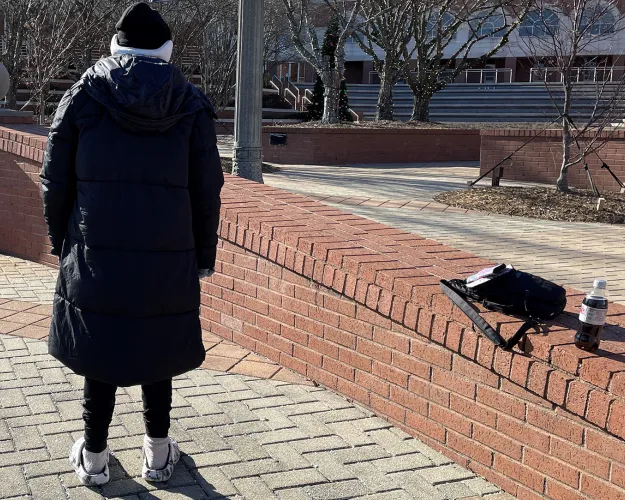 Outside the Rock Hill branch of the York County Library, a woman (she did not want her face or name to be public, but consented to being photographed) wiles away a cold January morning. She is one of what she's convinced is a growing number of people experiencing homelessness in the community.