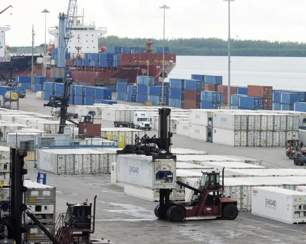 FILE - Dockworkers return to work at Port Miami, Oct. 4, 2024, in Miami, after the union representing 45,000 striking U.S. dockworkers at East and Gulf coast ports has reached a deal to suspend a three-day strike until Jan. 15 to provide time to negotiate a new contract. (AP Photo/Marta Lavandier, File)