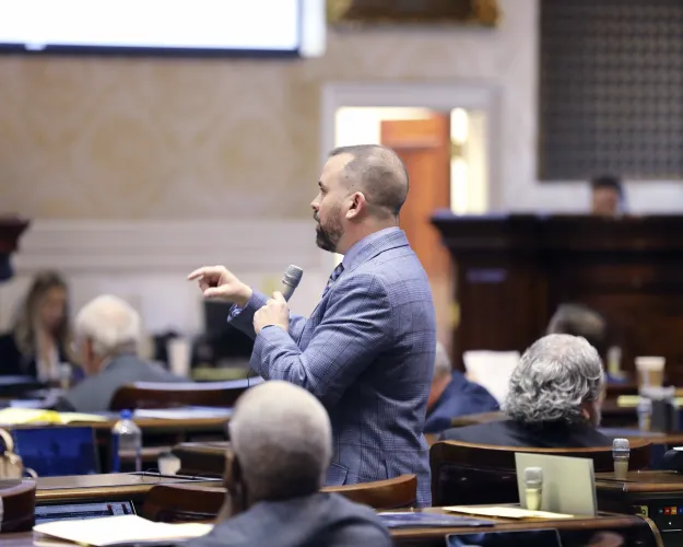 South Carolina Rep. Neal Collins, R-Easley, speaks about a voucher bill on the House floor on Wednesday, Feb. 26, 2024, in Columbia, S.C. (AP Photo/Jeffrey Collins)
