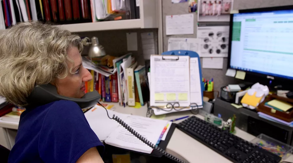 Caroline Wallinger discusses patients' readings and strategies during a weekly phone call.