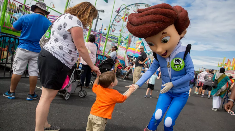 PBS Kids Character greets a young fan