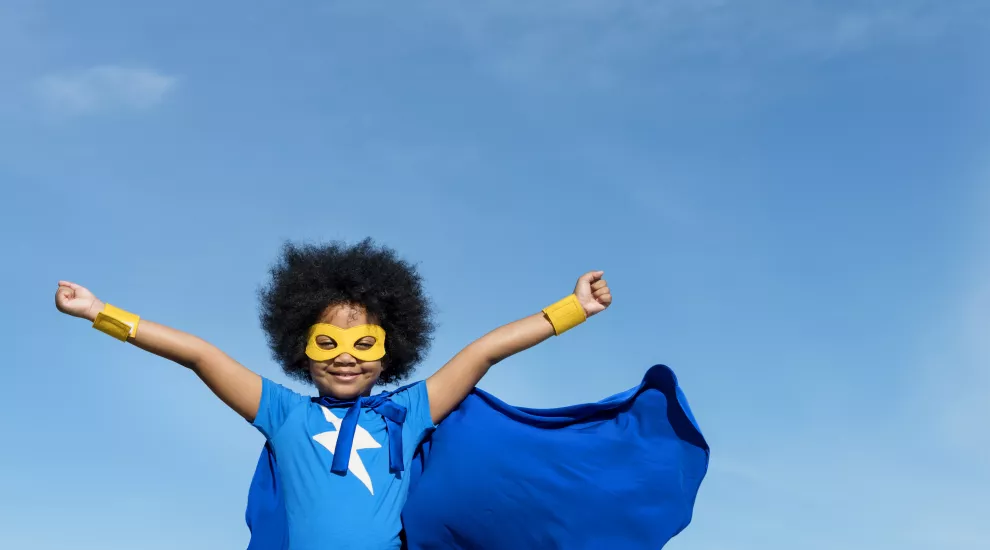 Girl dressed as a superhero