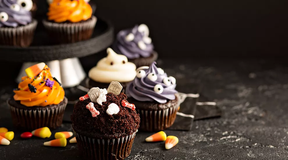Photo of Halloween treats - cupcakes decorated for Halloween and candy corn