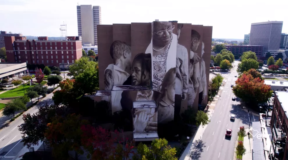 Image of a large mural painted on a building in Greenville, SC.