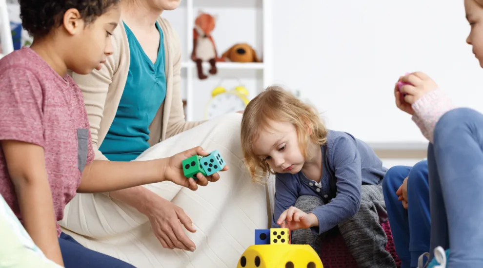 photo of young students using math block manipulatives