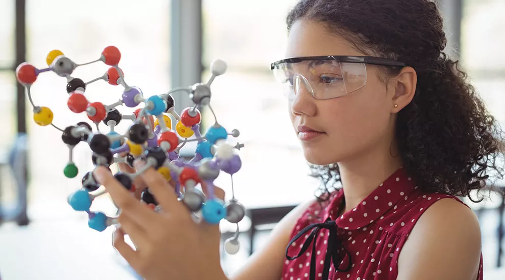 Young woman in science class