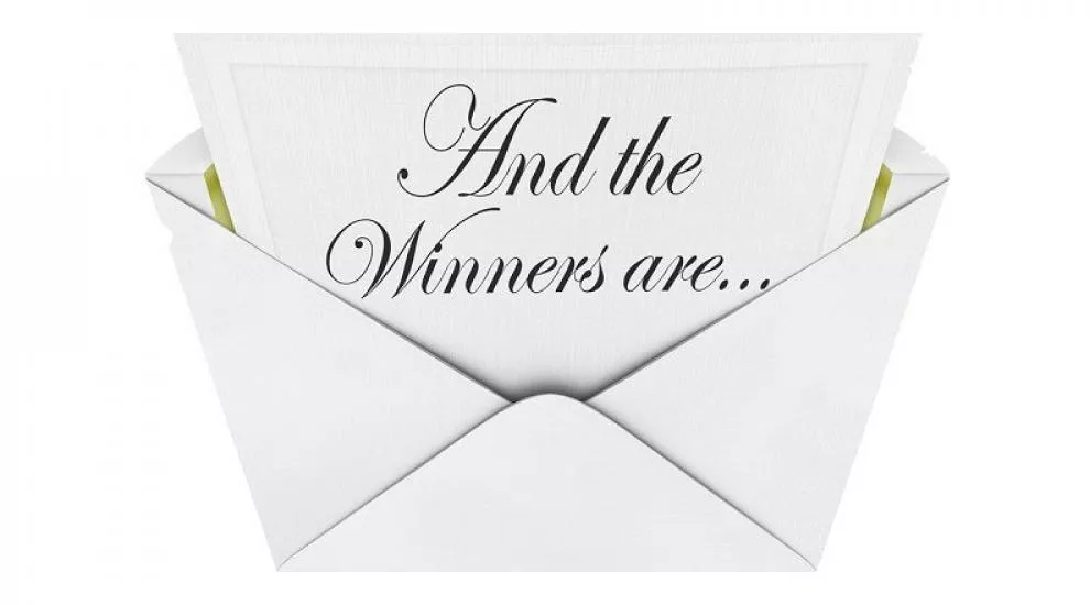 envelope with the the words "And The Winners Are"