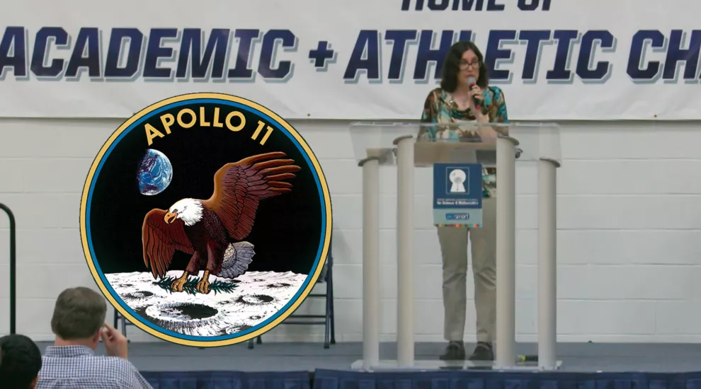 Dr. Myers on stage at GSSM in Hartsville. Next to her is the Apollo 11 mission patch.