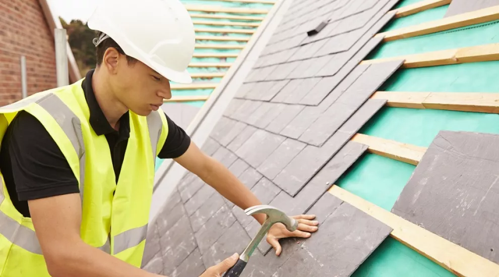 teen working on roof