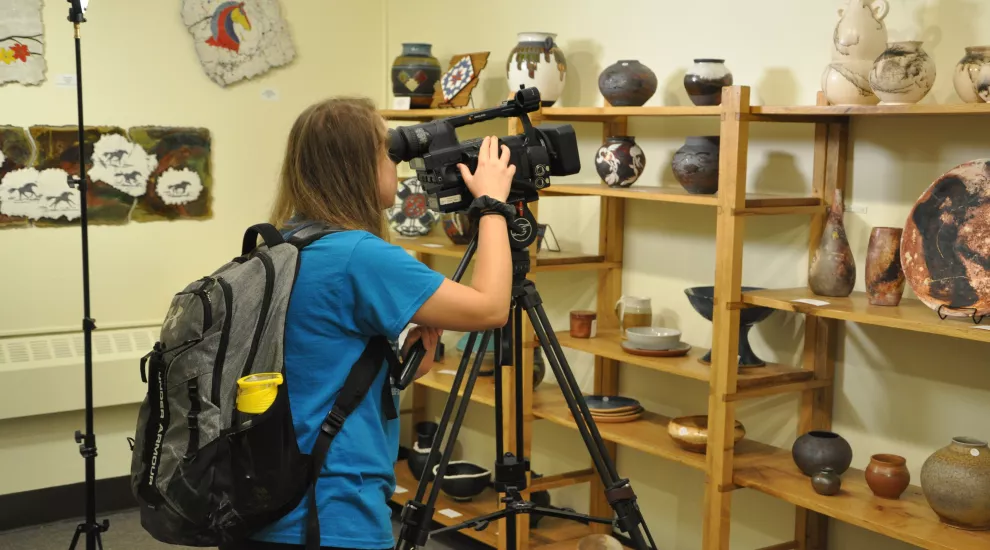 Raven Furber videos ceramics at the West Main Artists Co-op in Spartanburg, South Carolina