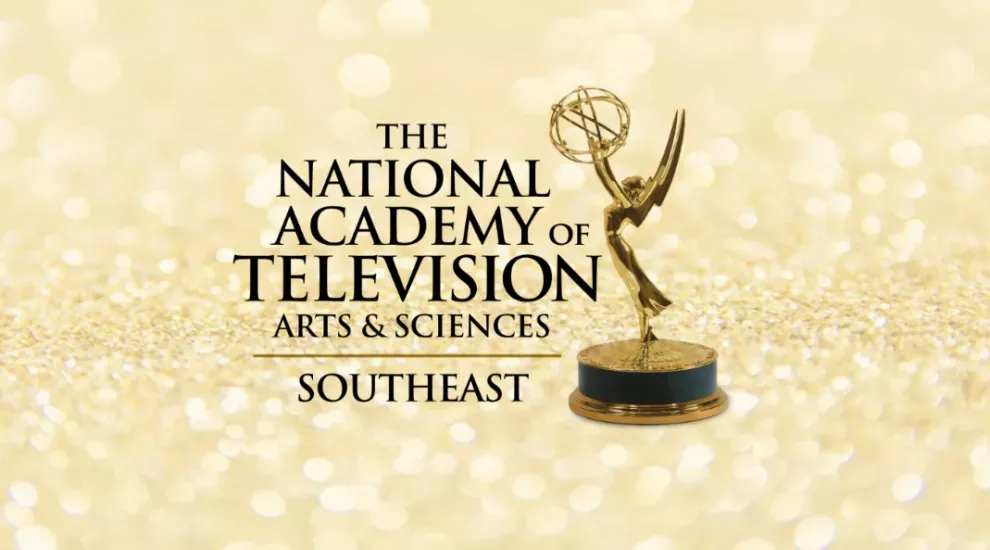 Southeast Emmy logo with trophy on gold background