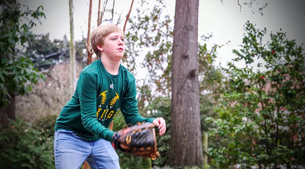 Griffin Wilbanks plays catch with Dad. 