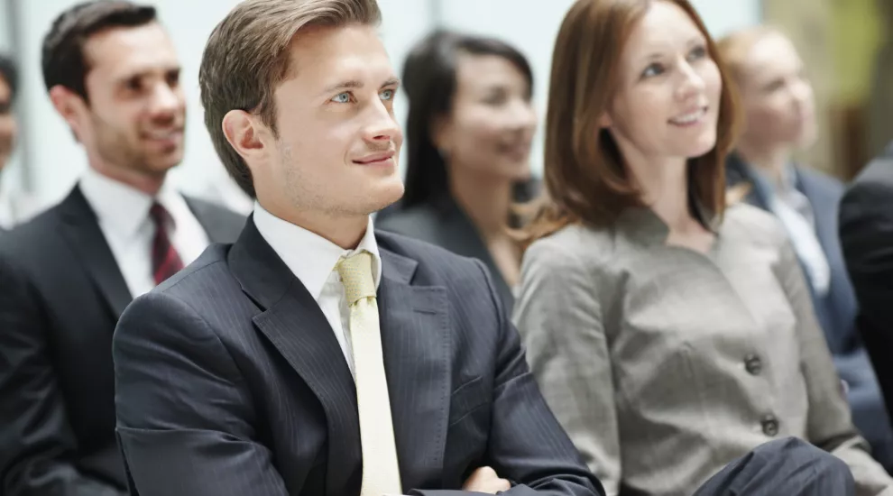 People watching a business seminar