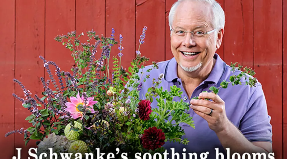 J Schwanke with a bouquet of flowers