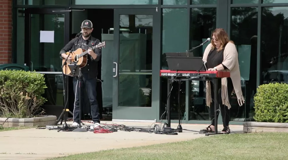 Musicians playing outside church doors