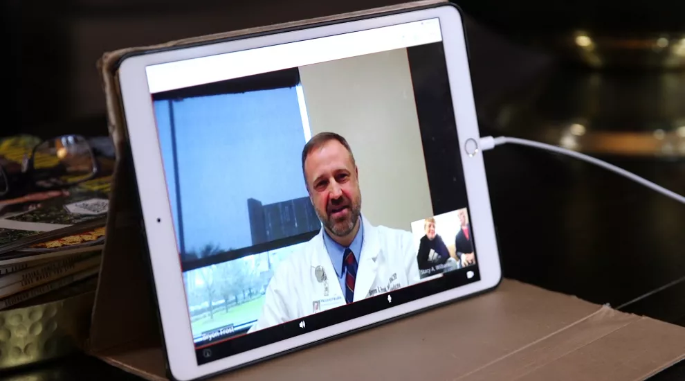 McLeod doctor sees patient over telehealth app.