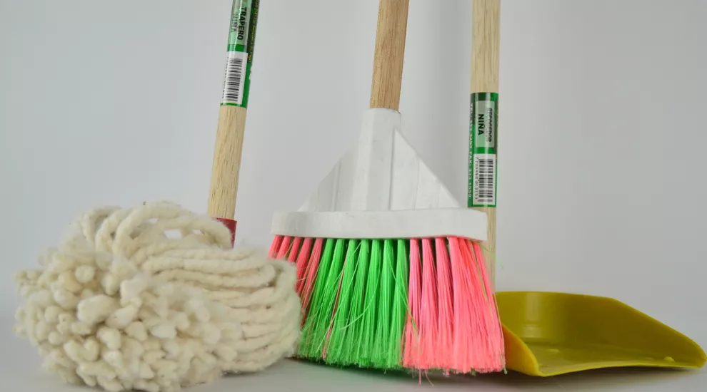 photo of a mop, broom and dustpan