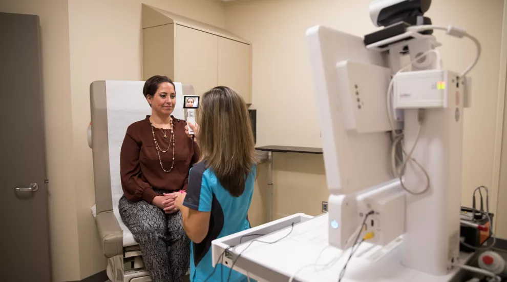 Tidelands nurse uses telehealth cart to get the patient connected to a MUSC specialist. 