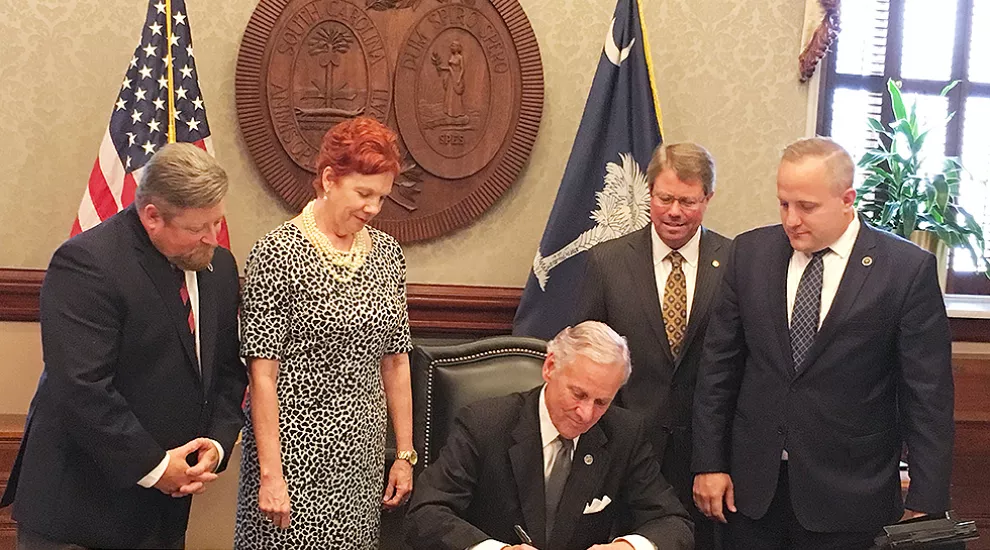 Gov. McMaster signs the bill into law on Tuesday, June 6, 2017.