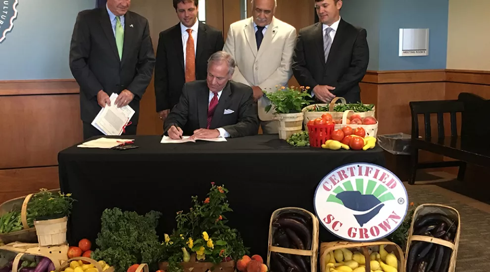 Gov. Henry McMaster signs the industrial hemp bill during a ceremonial bill signing on June 21, 2017.