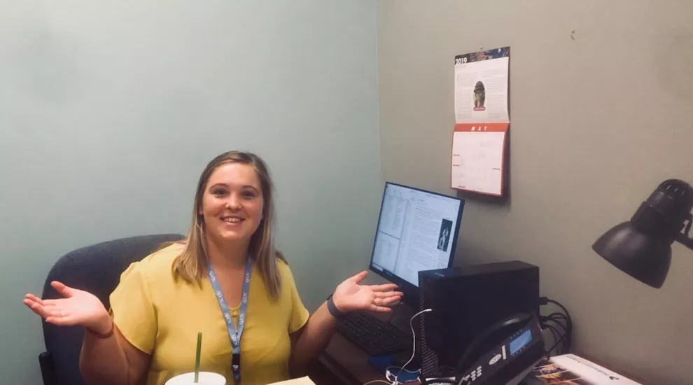 Sarah shows off her desk.