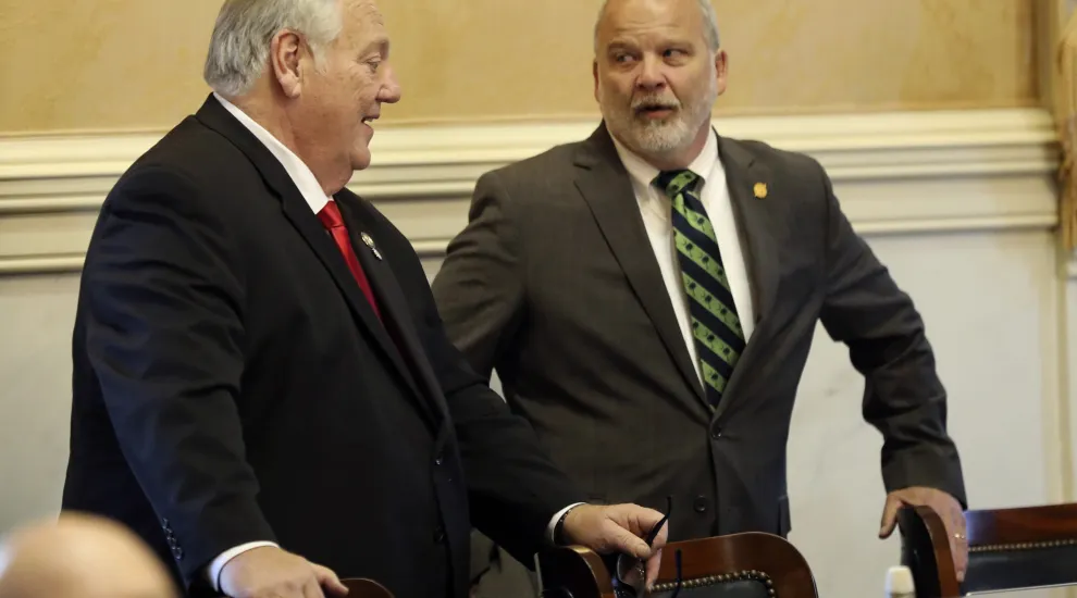 State Sens. Billy Garrett, left, R- Lexington, and Brian Adams, R-Goose Creek, talk before a Senate session, Tuesday, Jan. 14, 2025, in Columbia, S.C. (AP Photo/Jeffrey Collins)