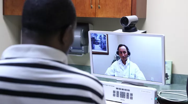 Robinson meeting with his doctor via telehealth.