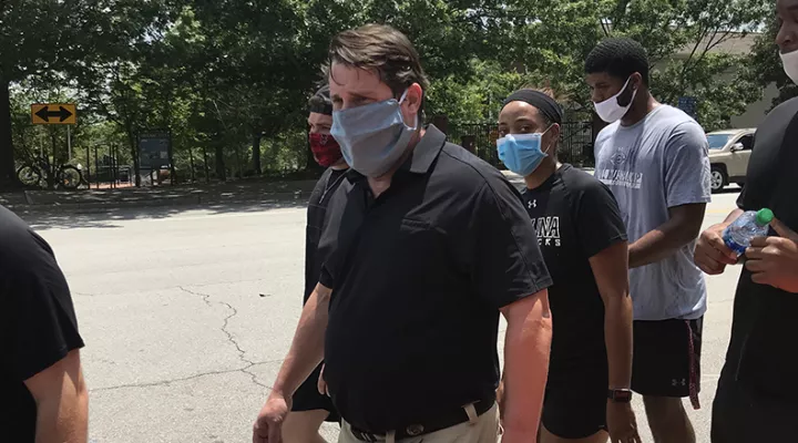 USC football coach Will Muschamp marches with players and other protesters outside of the Governor's Mansion on June 6, 2020 