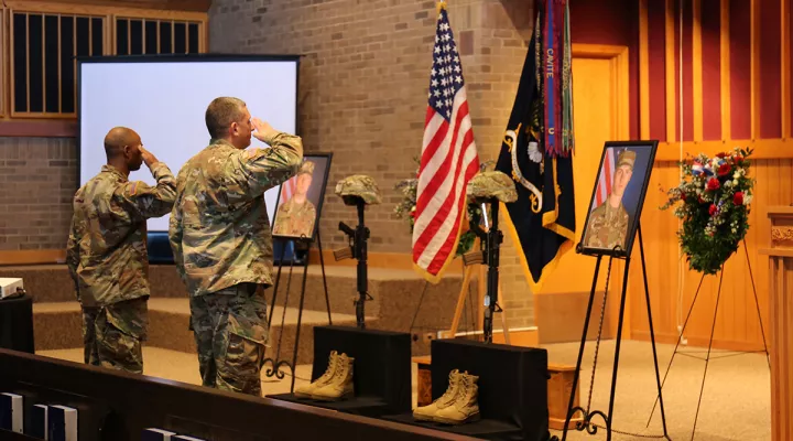 Soldiers participate in final salutes for Privates Timothy Ashcroft and Ethan Shrader during a memorial service