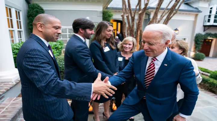 Sen. Kimpson pictured in Feb. 2020 shaking hands with Joe Biden