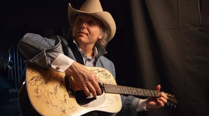 Dwight Yoakam plays a Martin D-28 guitar. Yoakam is among the 76 of the 101 country music artists interviewed for the series who signed two Martin D-28 guitars.
