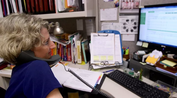 Caroline Wallinger discusses patients' readings and strategies during a weekly phone call.