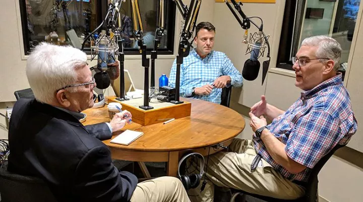 Gavin Jackson speaks with Russ McKinney (l) and Jeffrey Collins (r) in the South Carolina Public Radio studios 