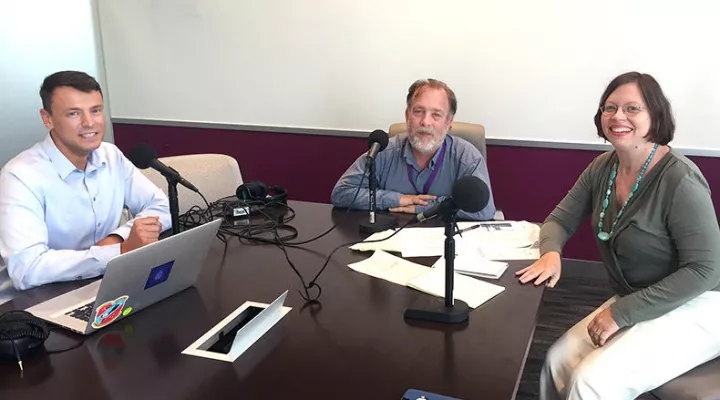 Gavin Jackson (l) speaks with Kirk Brown and Nikie Mayo (r) in the Greenville News offices.