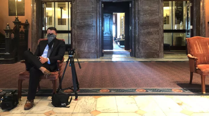 Gavin Jackson takes precautions while covering state lawmakers on Wednesday, April 8, 2020.