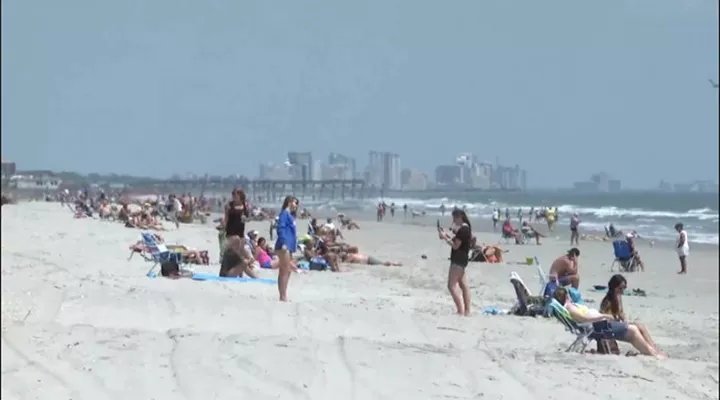 Residents on Garden City's beach following Gov. Henry McMaster's executive order that the state's beaches could reopen.
