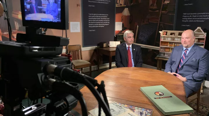 Harris Pastides and Doyle Stevick sit at a table at the Anne Frank Center at UofSC 