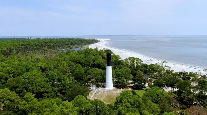lighthouse next to beach