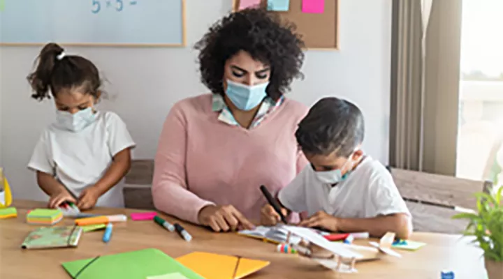 Mother working on project with her children