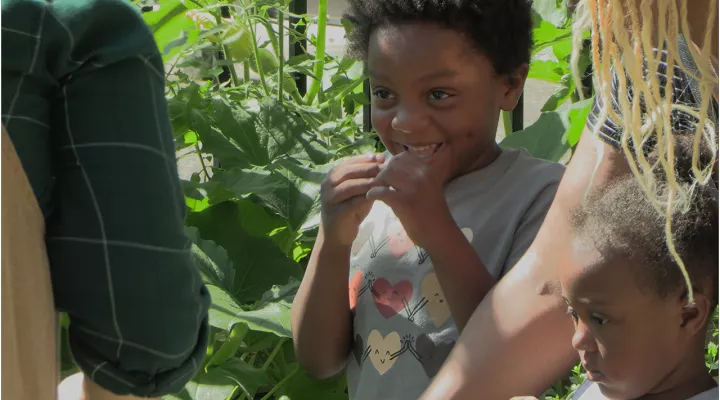 Child in the EdVenture’s Eco Garden