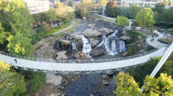 Aerial view of the Liberty Bridge and waterfall in Falls Park, Greenville.